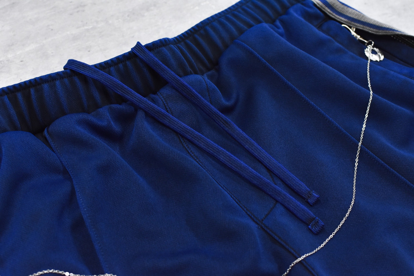 BODYSONG. / PIGMENT-DYED DISTRESSED TRACK TROUSERS - BLUE