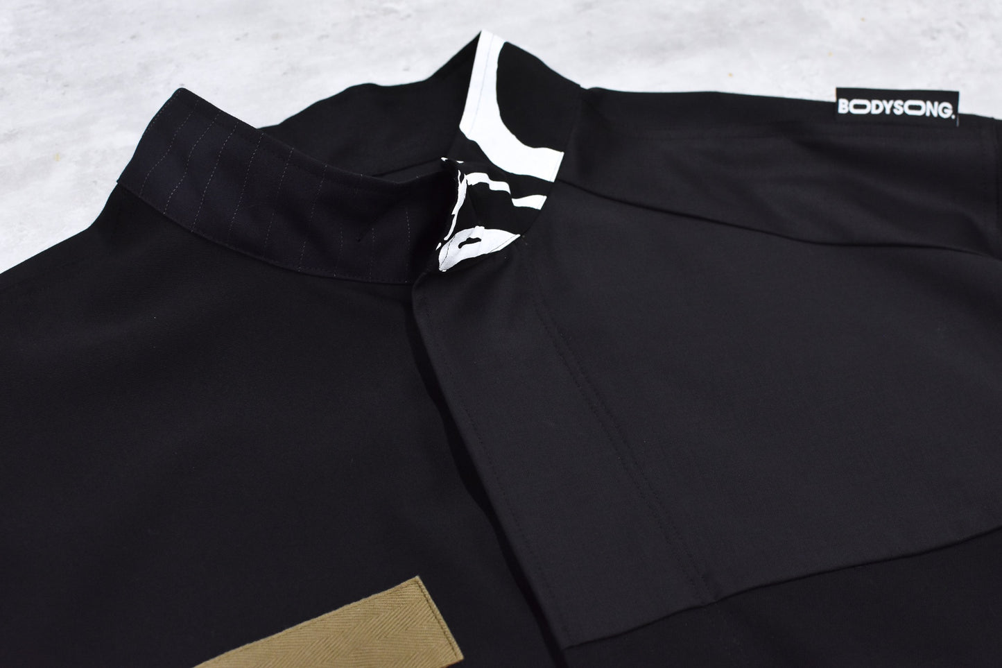 BODYSONG. / PATCHWORK MIL COAT MADE BY DISASSEMBLING AND RECONSTRUCTING A BUSINESS SUIT