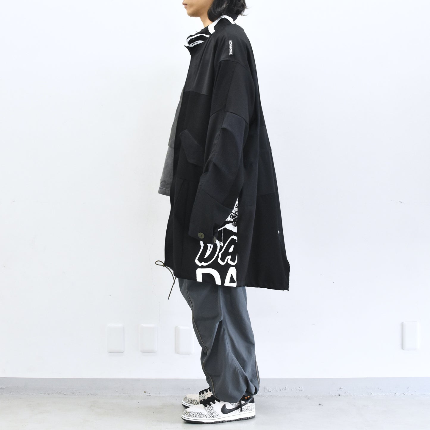BODYSONG. / PATCHWORK MIL COAT MADE BY DISASSEMBLING AND RECONSTRUCTING A BUSINESS SUIT