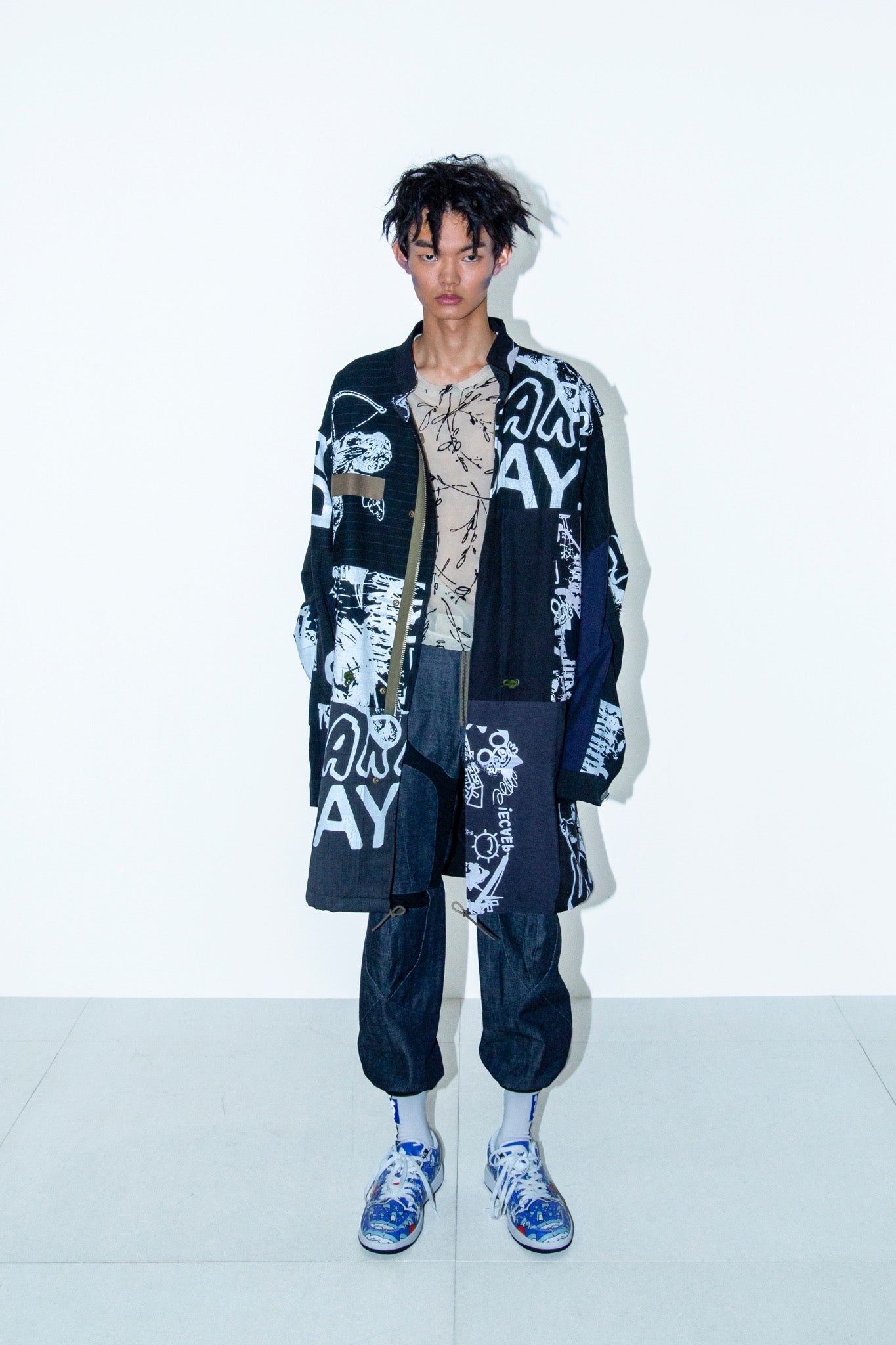 BODYSONG. / PATCHWORK MIL COAT MADE BY DISASSEMBLING AND RECONSTRUCTING A BUSINESS SUIT