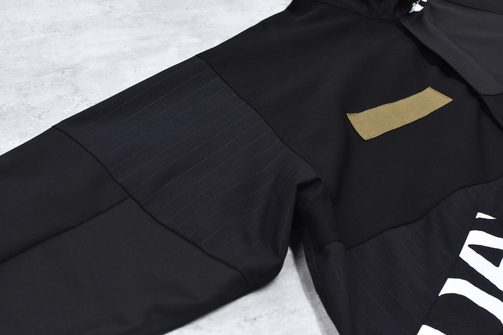 BODYSONG. / PATCHWORK MIL COAT MADE BY DISASSEMBLING AND RECONSTRUCTING A BUSINESS SUIT