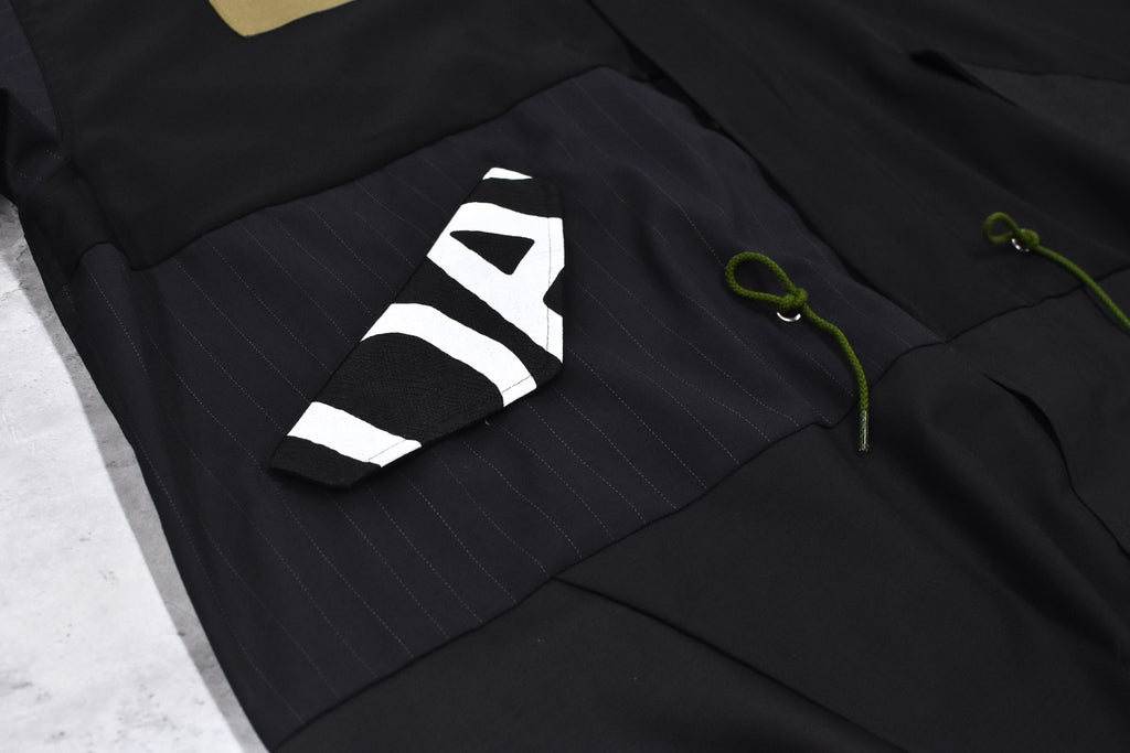 BODYSONG. / PATCHWORK MIL COAT MADE BY DISASSEMBLING AND RECONSTRUCTING A BUSINESS SUIT